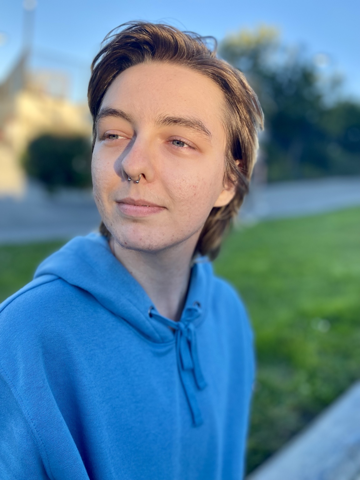 Calvin M. Anderson outdoors in a blue hoodie